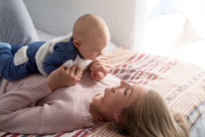 Happy Mother With Baby - Bella Mama